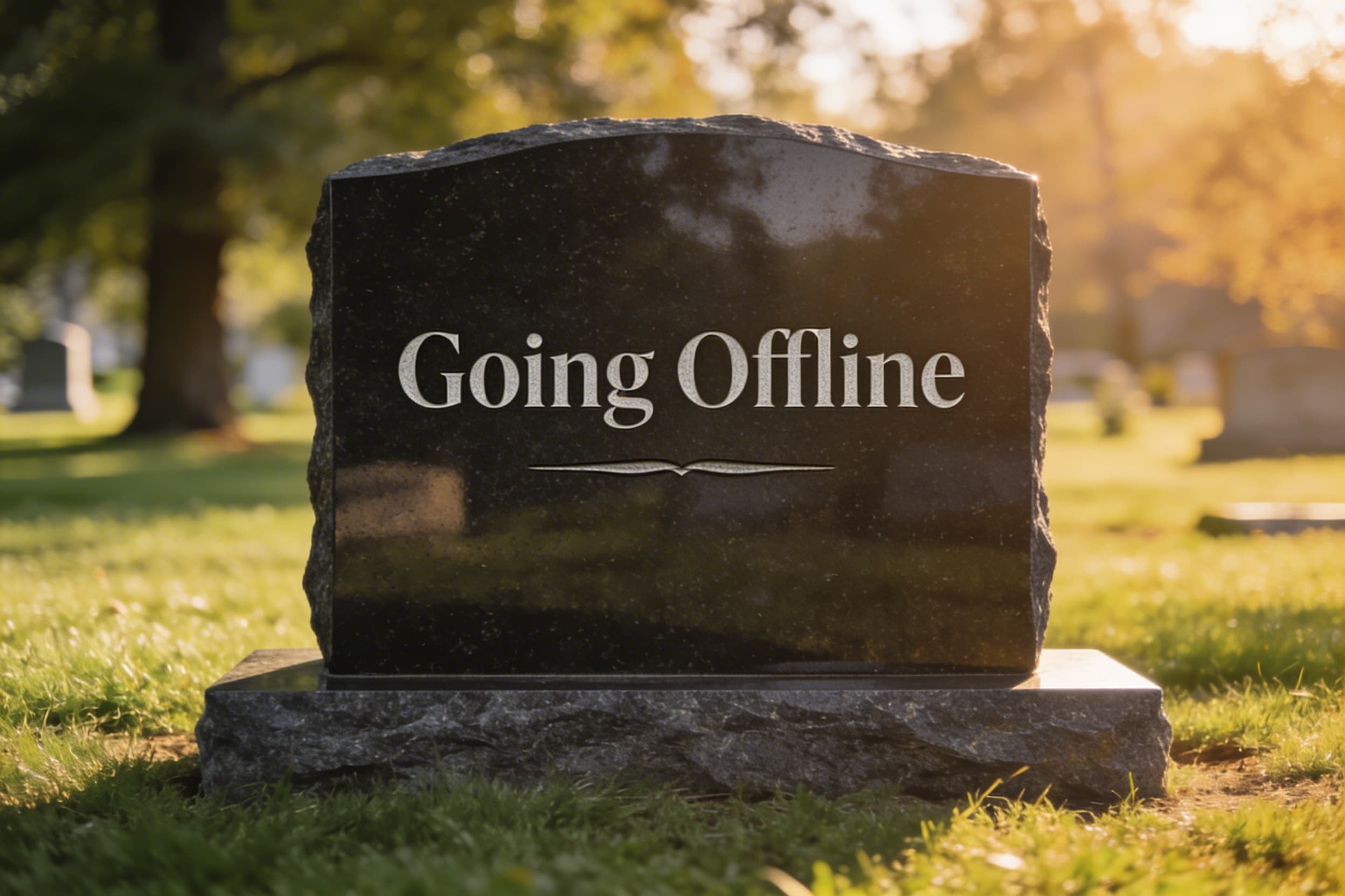 A polished dark granite headstone in a peaceful cemetery with engraved text that reads exactly "Going Offline" in a clean serif font