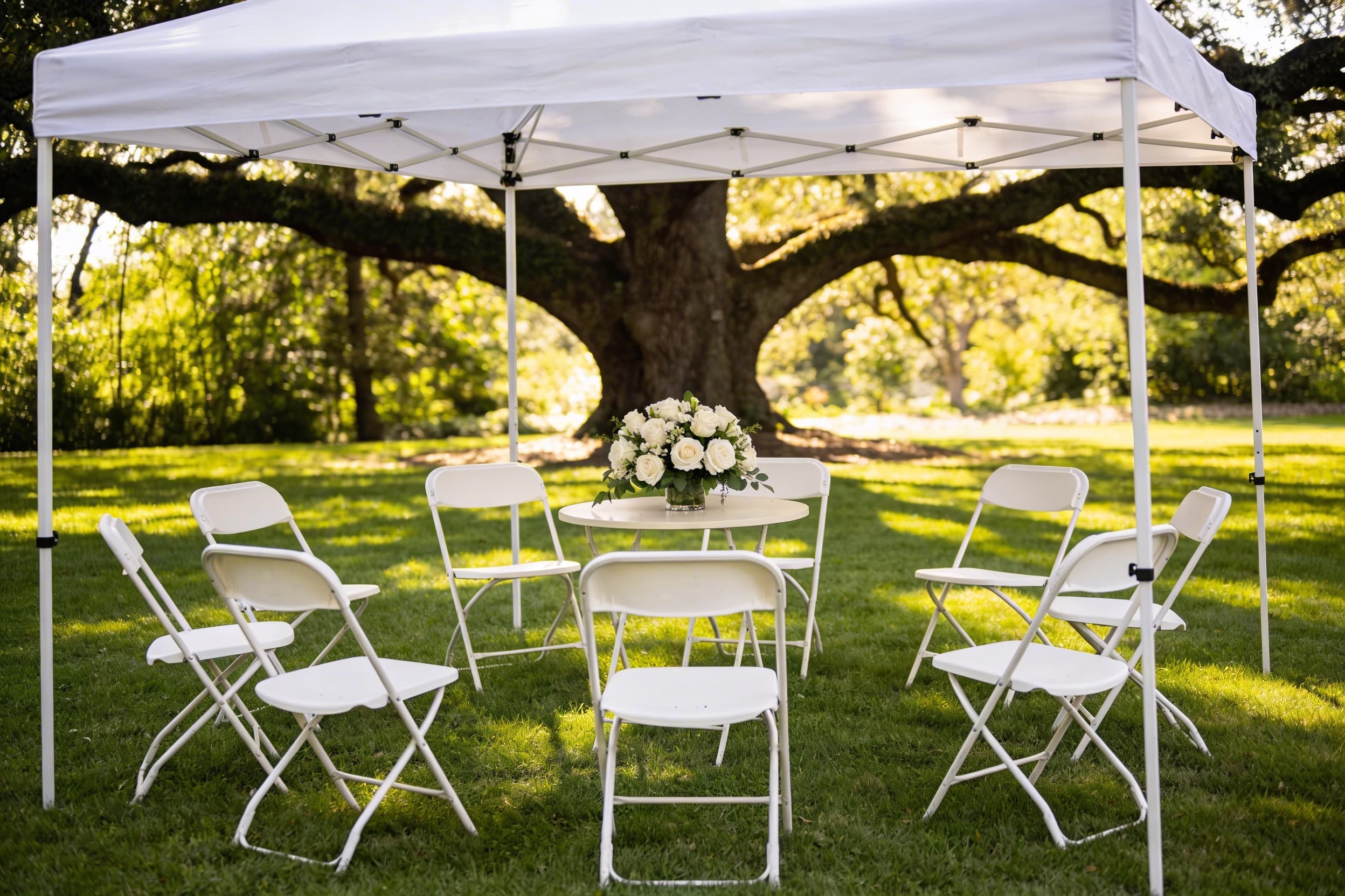An intimate outdoor funeral reception with guests gathered in a garden setting with white chairs and floral arrangements