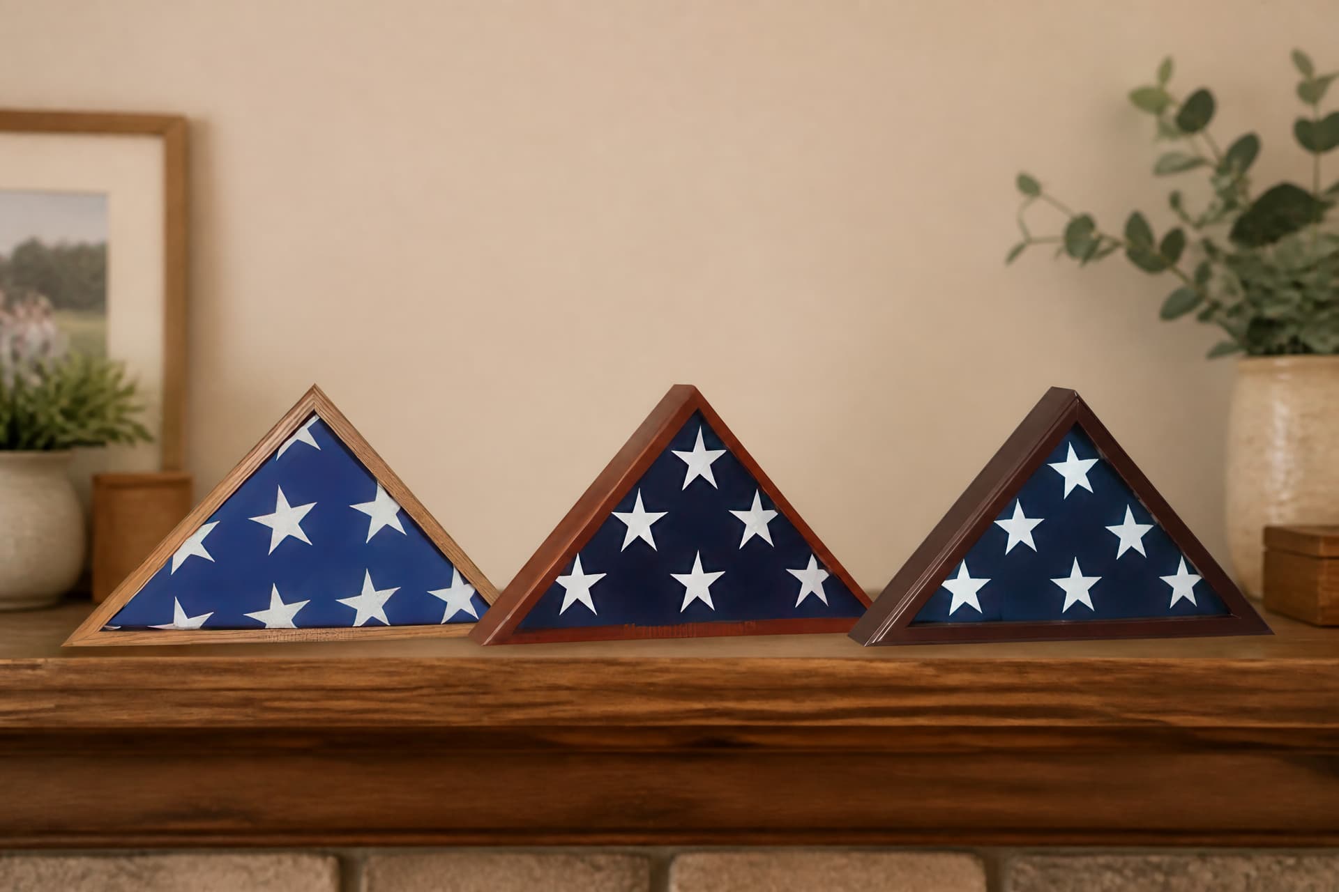 3 memorials shown standing side by side on a mantel at home