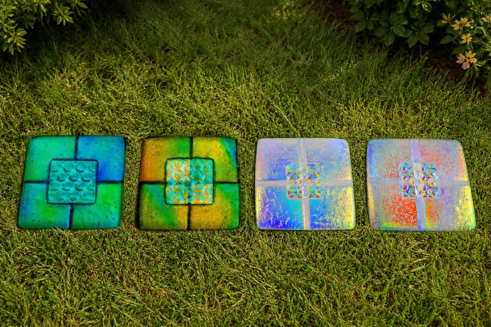 Engraved pet memorial tiles and keepsakes arranged on a wooden surface