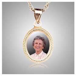 This elegant pendant features a photo and stores cremation ashes
