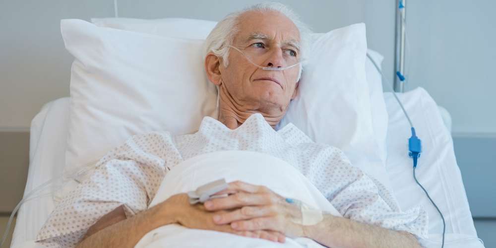 Older gentleman in hospital bed